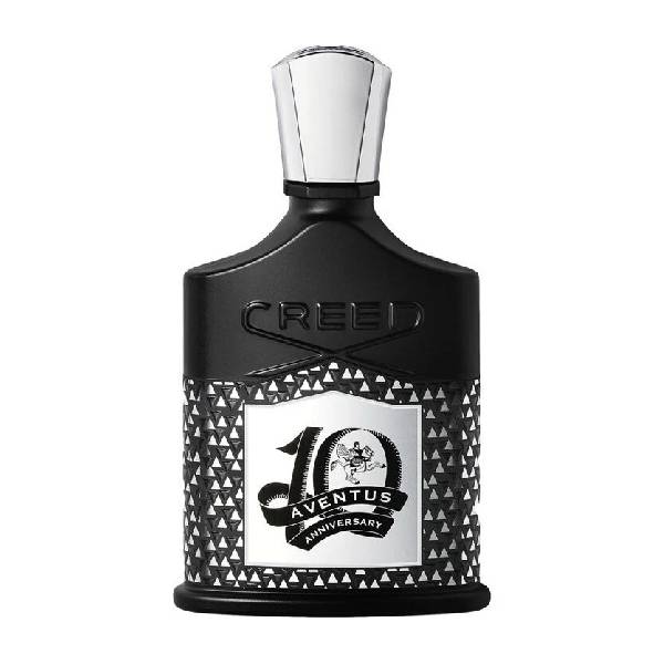 Elegant black Creed 10th Anniversary perfume bottle with intricate design.