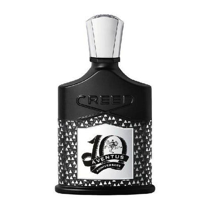 Elegant black Creed 10th Anniversary perfume bottle with intricate design.