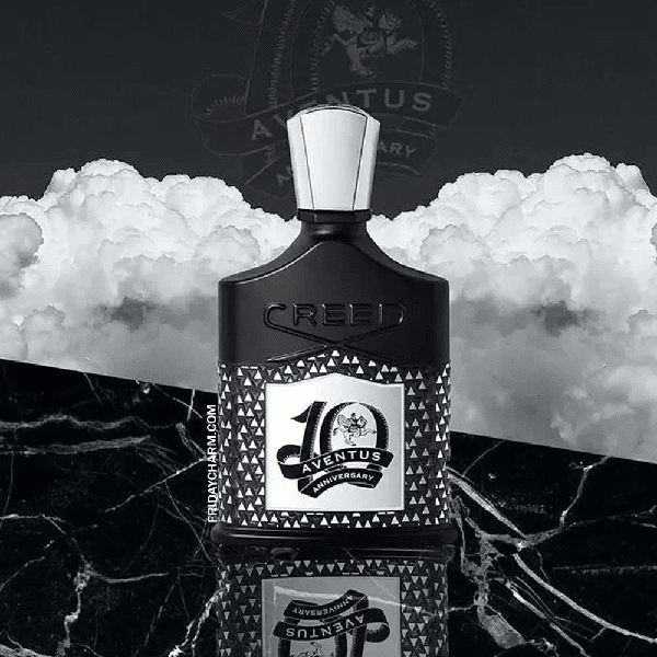 Elegant black perfume bottle with a white cap on marble surface.
