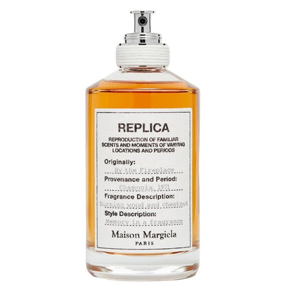 Bottle of Maison Margiela Replica fragrance with a white label.