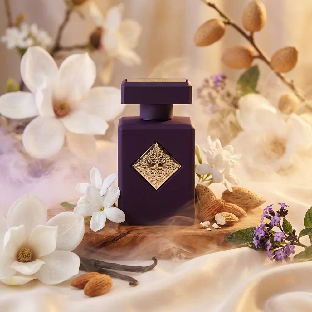 Purple fragrance bottle surrounded by white flowers, vanilla and almonds